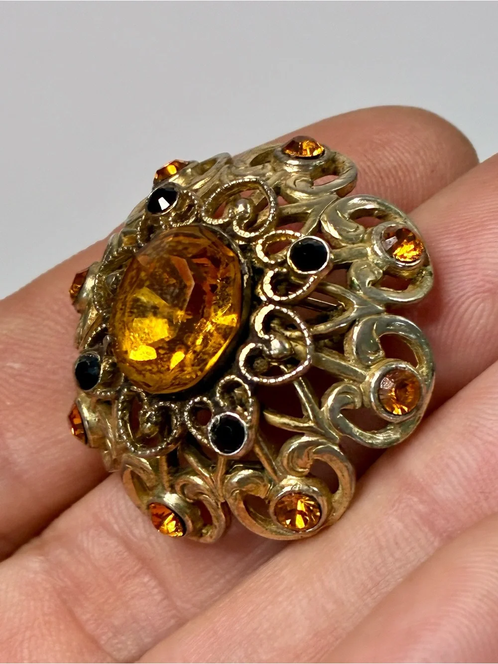 Coro Gold-Tone Heart Shaped Ornate Filigree Brooch with Amber and Black Stones